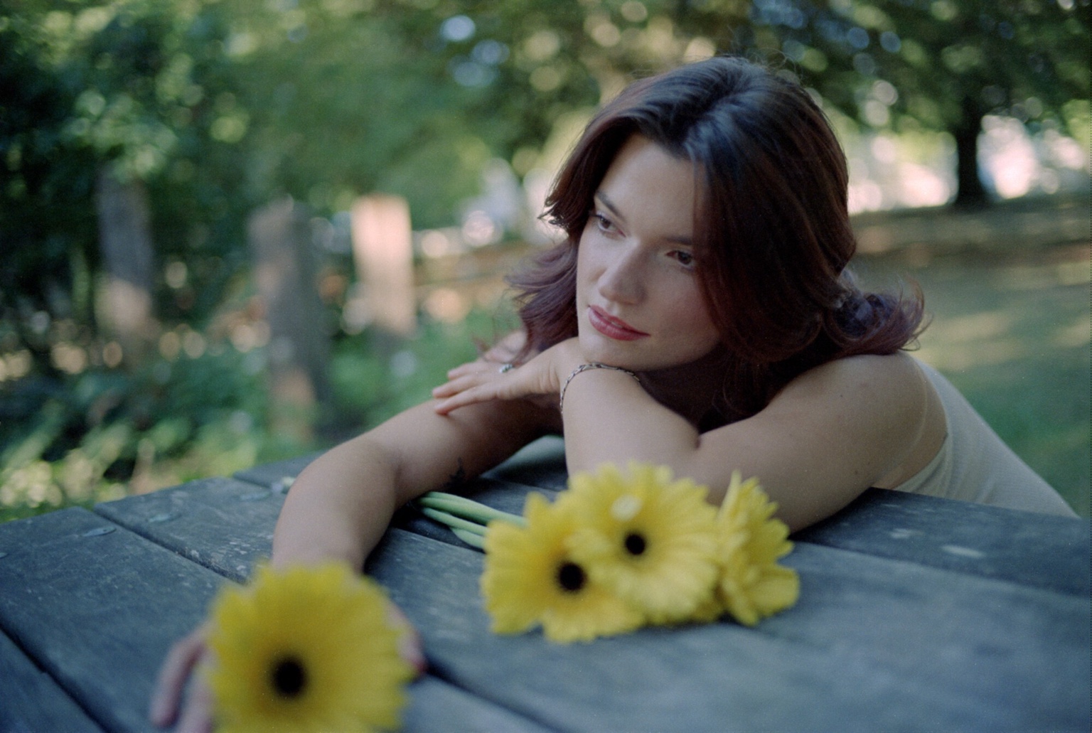 Intimate portrait at a wooden table with flowers